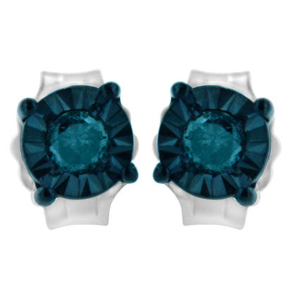 Close-up front view of white metal stud earrings with round blue gemstones in a miracle setting.