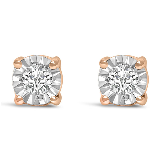 Front view of a pair of rose-colored stud earrings with round white gemstones set in a miracle setting.