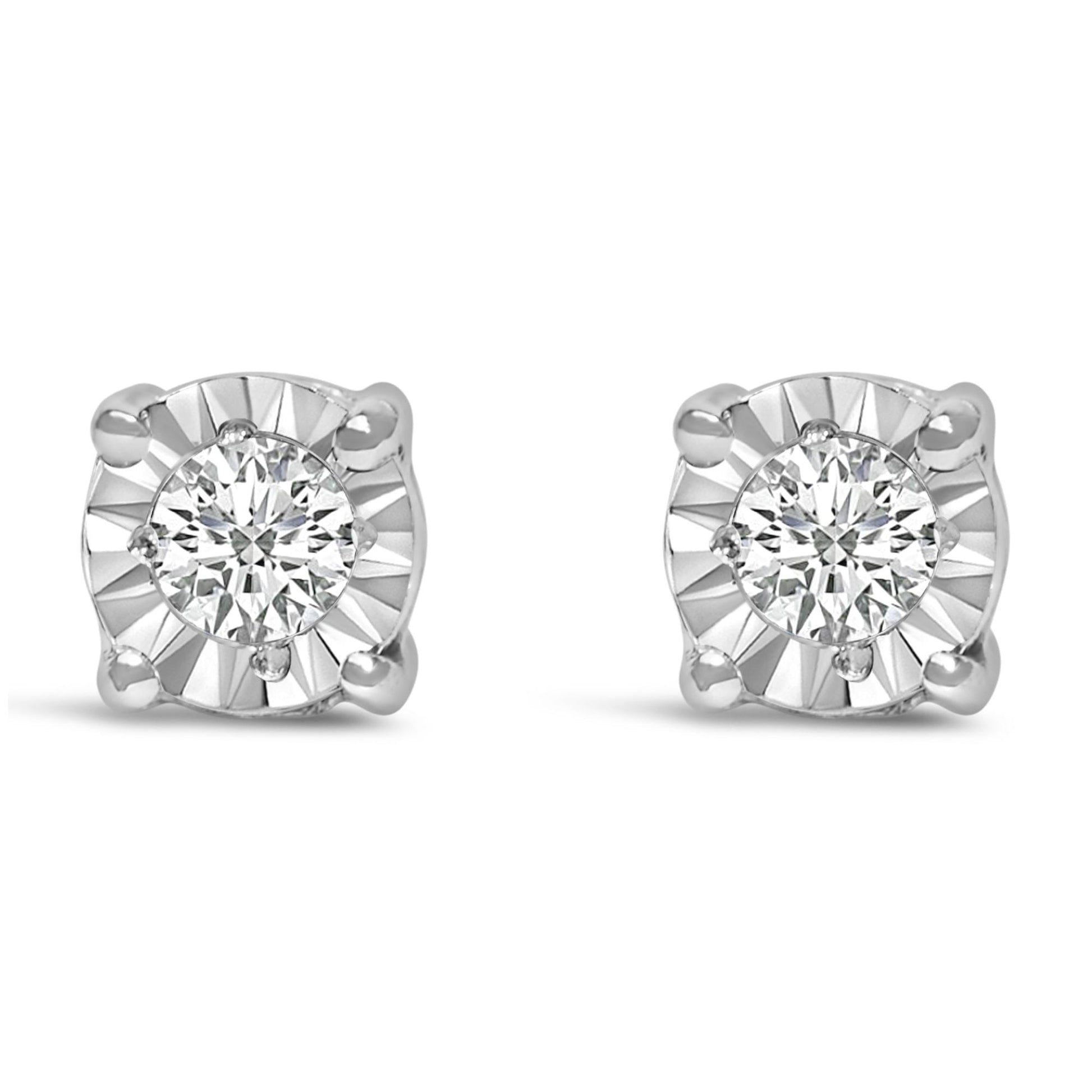 Front angle view of a pair of white metal stud earrings featuring a central round white gemstone in a miracle setting.