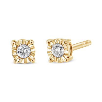 Close-up front and side angle of yellow metal stud earrings with round white gemstones in miracle settings.