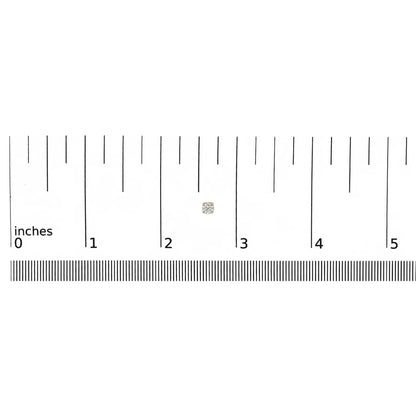 Close-up shot of a yellow metal round-shaped earring with two white gemstones in miracle setting, shown on a ruler for size reference.