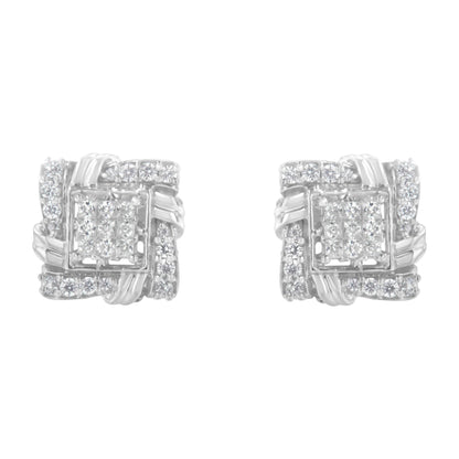 Front view of a pair of white metal square-shaped earrings featuring white round gemstones in prong settings and white princess gemstones in invisible settings.