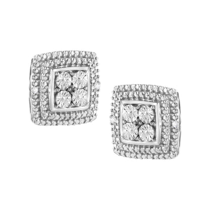 Close-up front angle of a pair of white metal square-shaped earrings, each featuring a cluster of round white gemstones in the center surrounded by micro-pave set white gemstones.