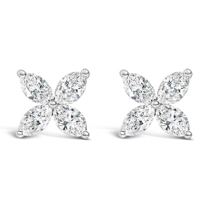 Pair of white metal earrings with four marquise-shaped white gemstones arranged in a floral pattern, front-facing angle.