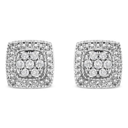 Front view of a pair of square white metal earrings with multiple round white gemstones set in prong settings.