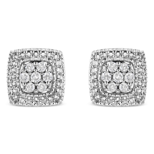 Front view of a pair of square white metal earrings with multiple round white gemstones set in prong settings.