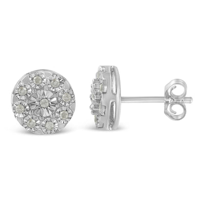 Front and side view of a pair of round white metal stud earrings with multiple round white gemstones in a cluster setting.
