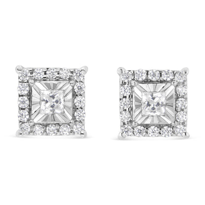 Pair of square white metal earrings with a central white gemstone in miracle setting surrounded by smaller round white gemstones in prong setting, front-facing angle.