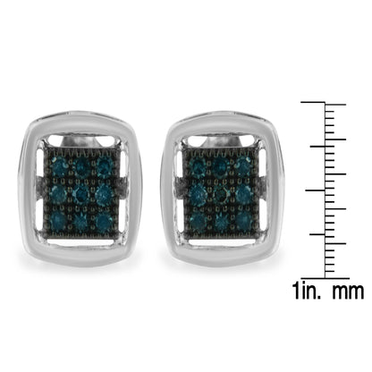 Front view of square white metal earrings with small round blue gemstones in prong settings, shown next to a ruler for size reference.