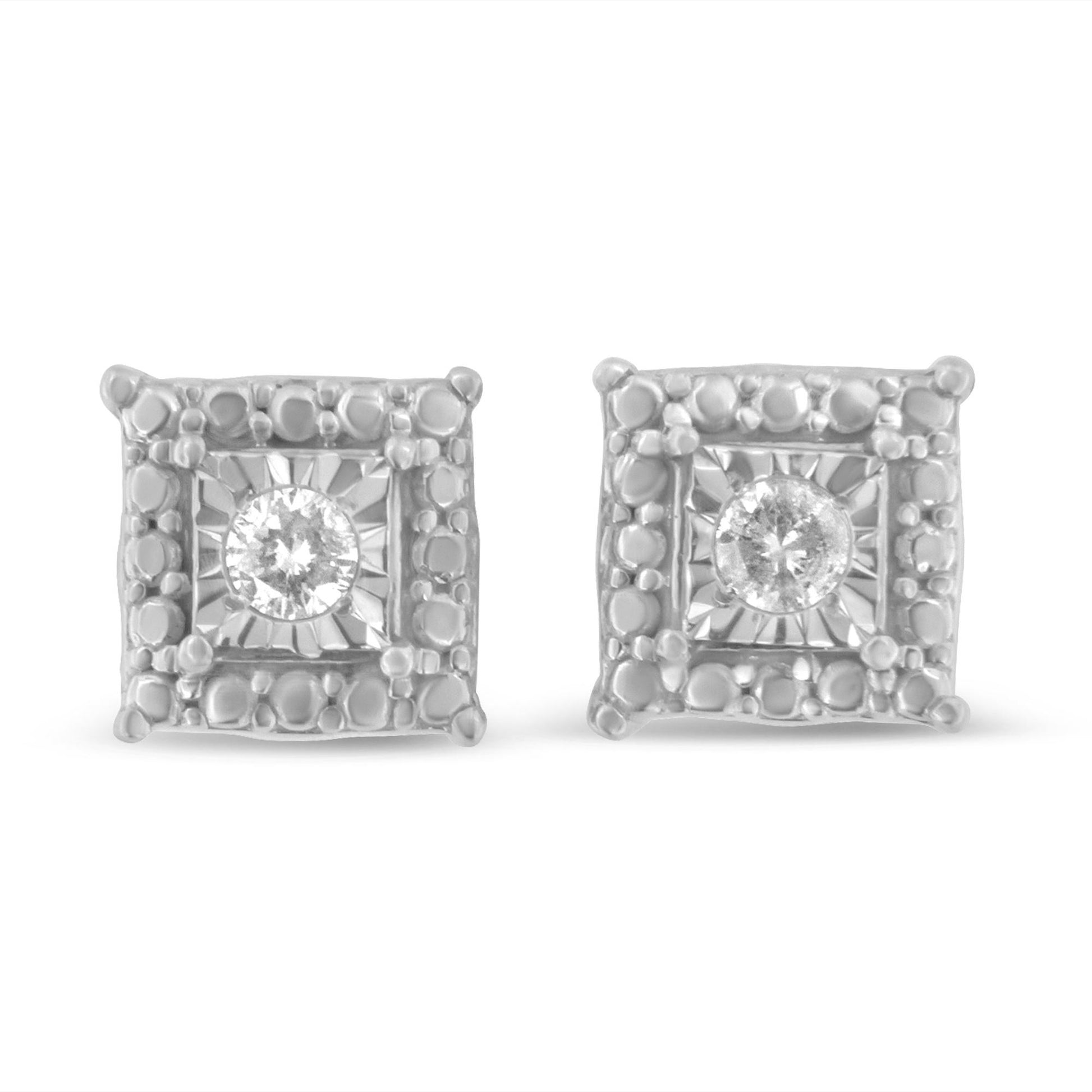 Front view of white metal square-shaped earrings with round white gemstones in the center and textured borders.