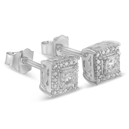 Close-up front angle view of a pair of white metal stud earrings with square shapes, featuring a central round white gemstone in a miracle setting surrounded by small white gemstones.