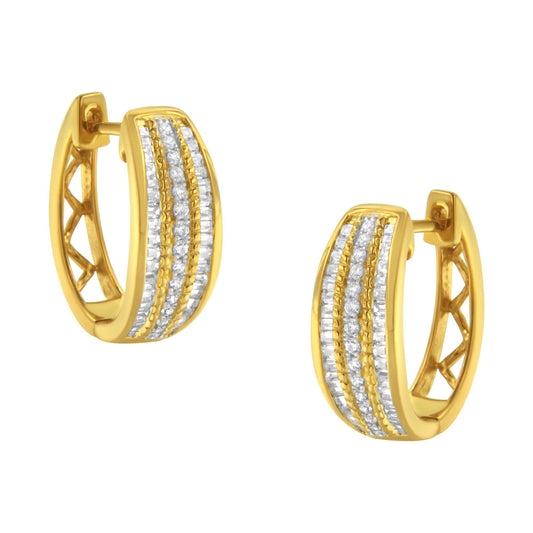 Pair of yellow metal hoop earrings with three vertical rows of white round and baguette gemstones, shown at a slight angle.