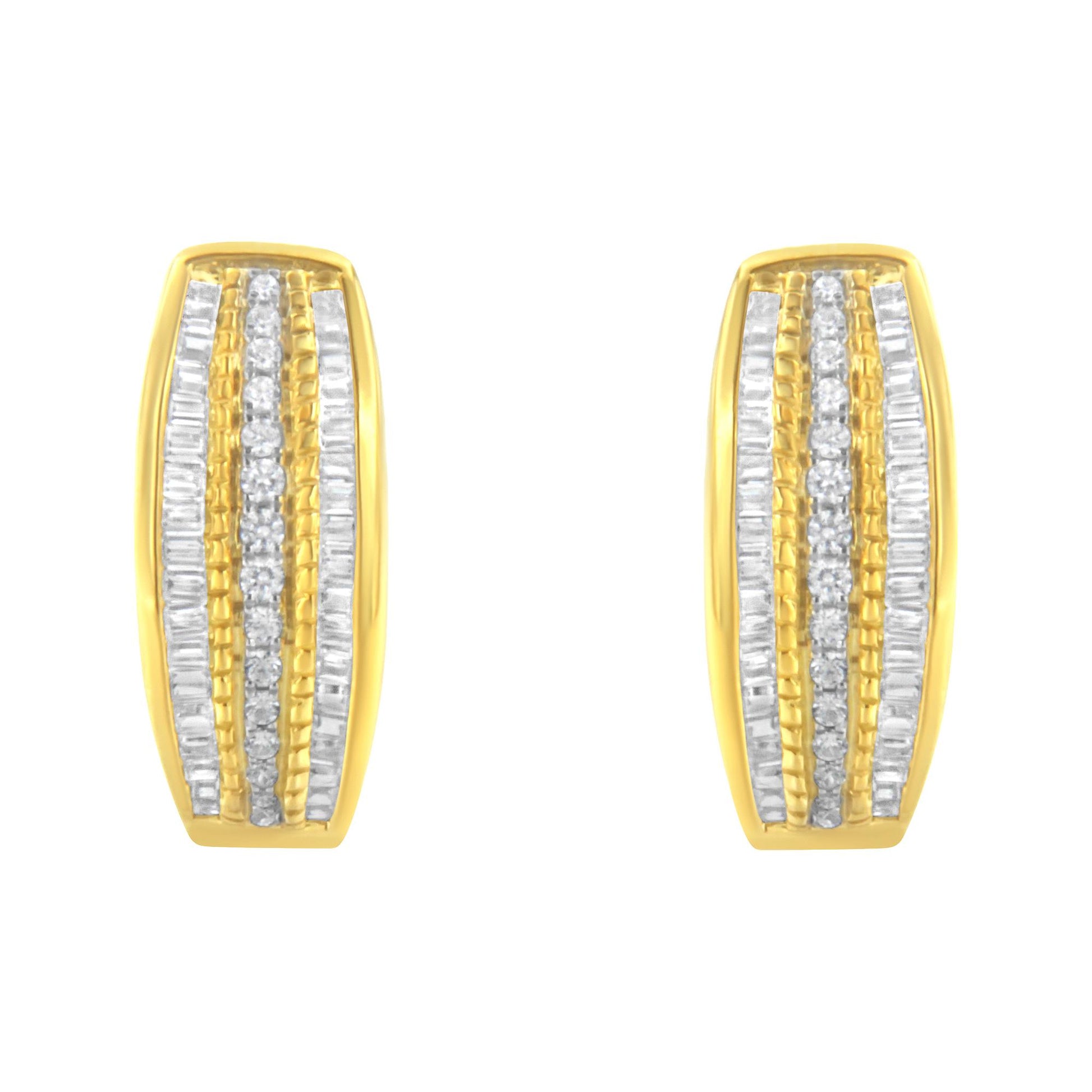 Front view of a pair of yellow metal earrings with rows of white round pave set gemstones in the center and white baguette channel set gemstones on each side.