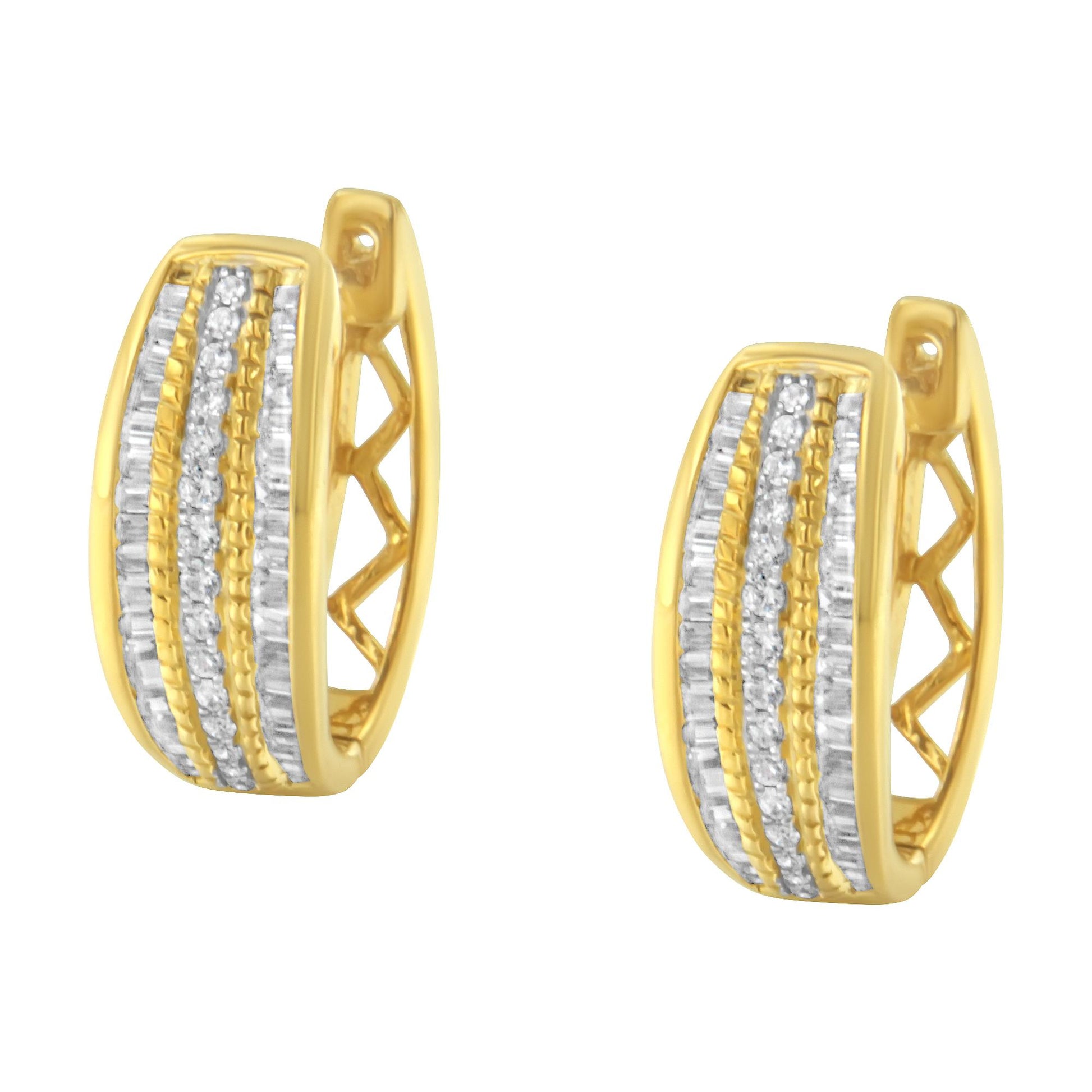 Front angled view of yellow metal hoop earrings featuring alternating rows of white round and baguette gemstones in pave and channel settings.