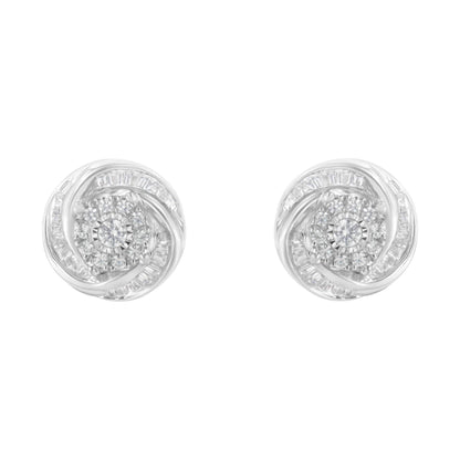 Pair of white metal round stud earrings with a central round gemstone cluster surrounded by baguette-shaped gemstones in a swirling design, shown from the front.