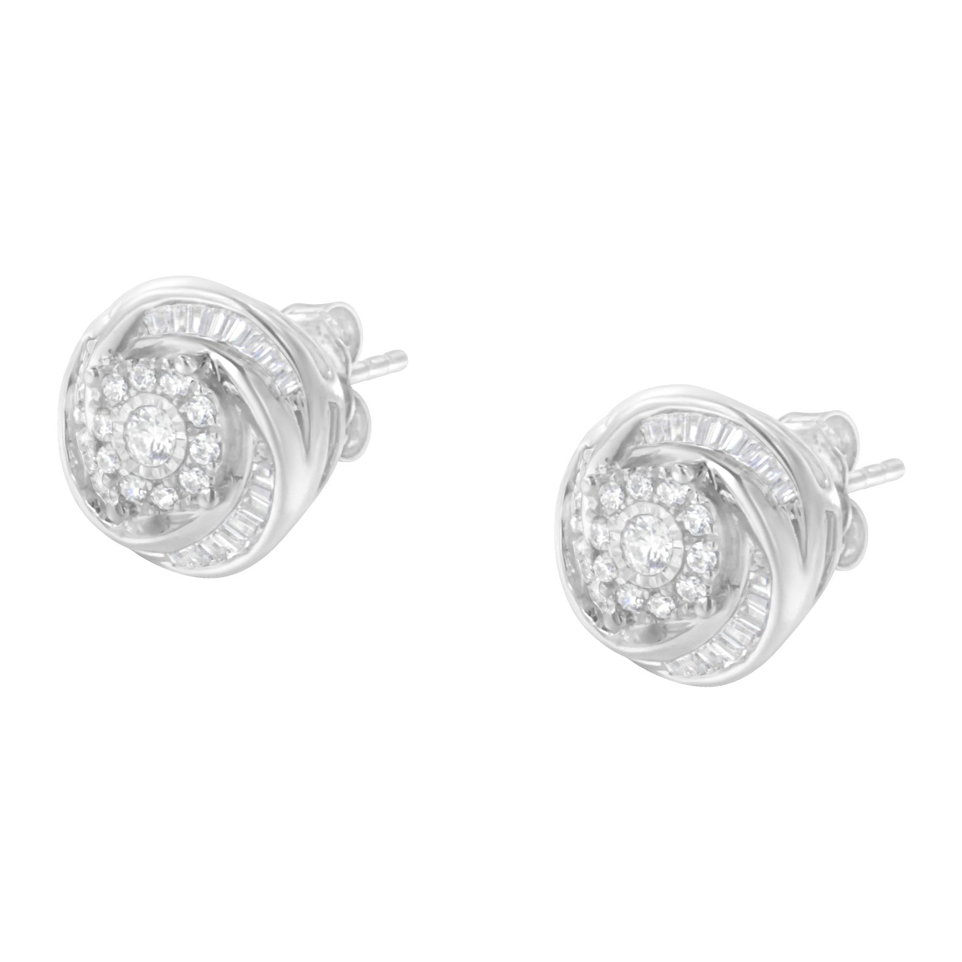 Pair of white metal stud earrings with round and baguette-shaped white gemstones, shown from a front angled view.