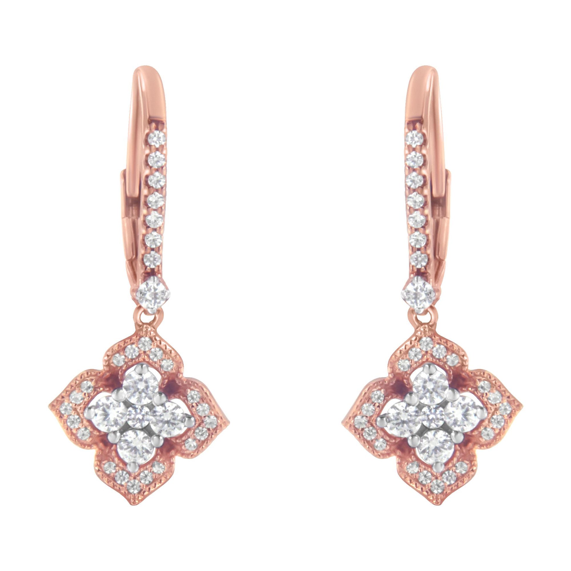 Front-facing view of a pair of rose-colored earrings with round white gemstones in prong settings, featuring a floral-inspired design.