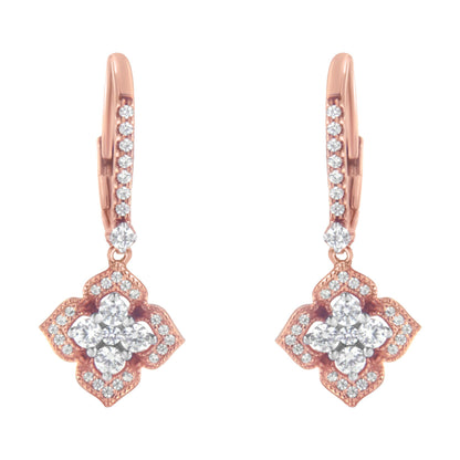 Front-facing view of a pair of rose-colored earrings with round white gemstones in prong settings, featuring a floral-inspired design.