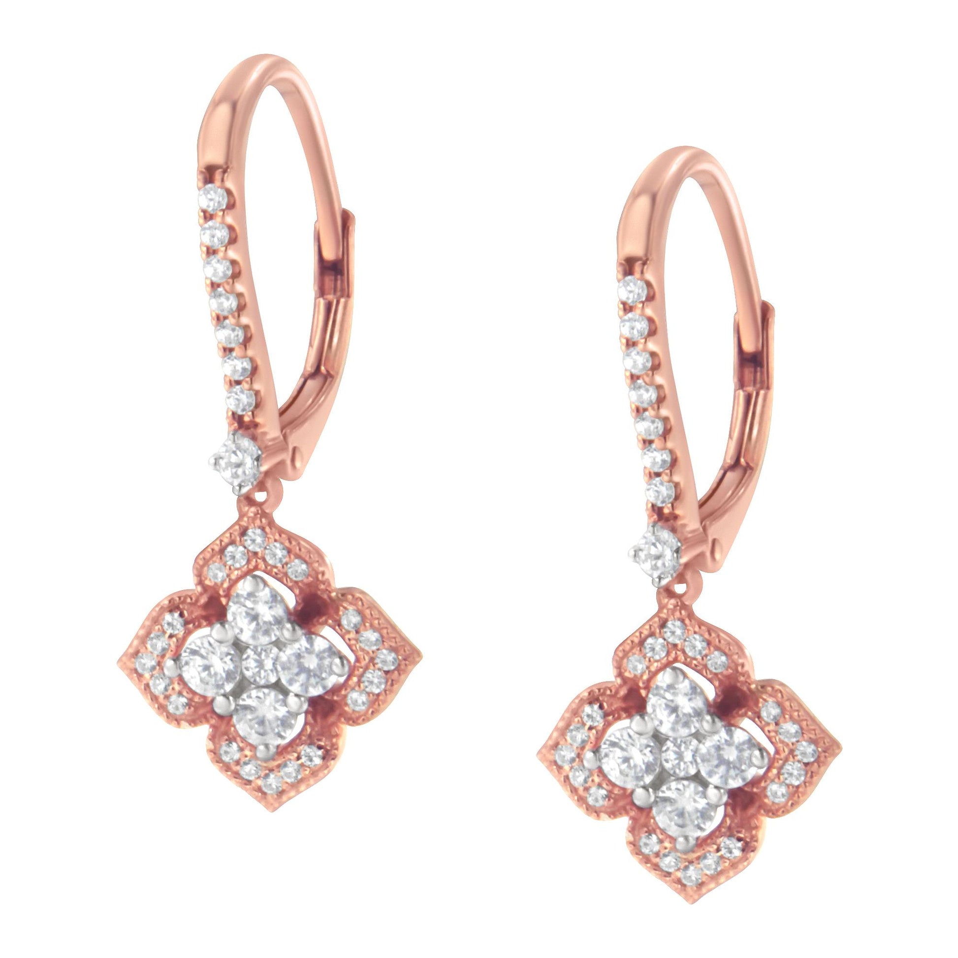 Pair of rose metal drop earrings with white round gemstones in prong settings, shown from a front angle.