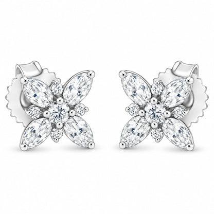 Front view of 14K white gold flower stud earrings showcasing eight marquise and two round diamonds on white background