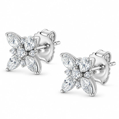 Angled view of 14K white gold flower stud earrings showcasing eight marquise and two round diamonds with push backs