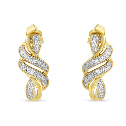 Front view of a pair of earrings with a twisted ribbon design featuring yellow and white metal sections adorned with pavé-set round white gemstones.