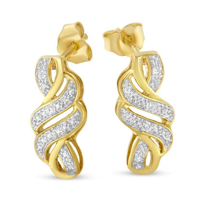 Pair of yellow metal earrings with an intertwined ribbon design featuring pave-set white gemstones, shown in a front-facing view.
