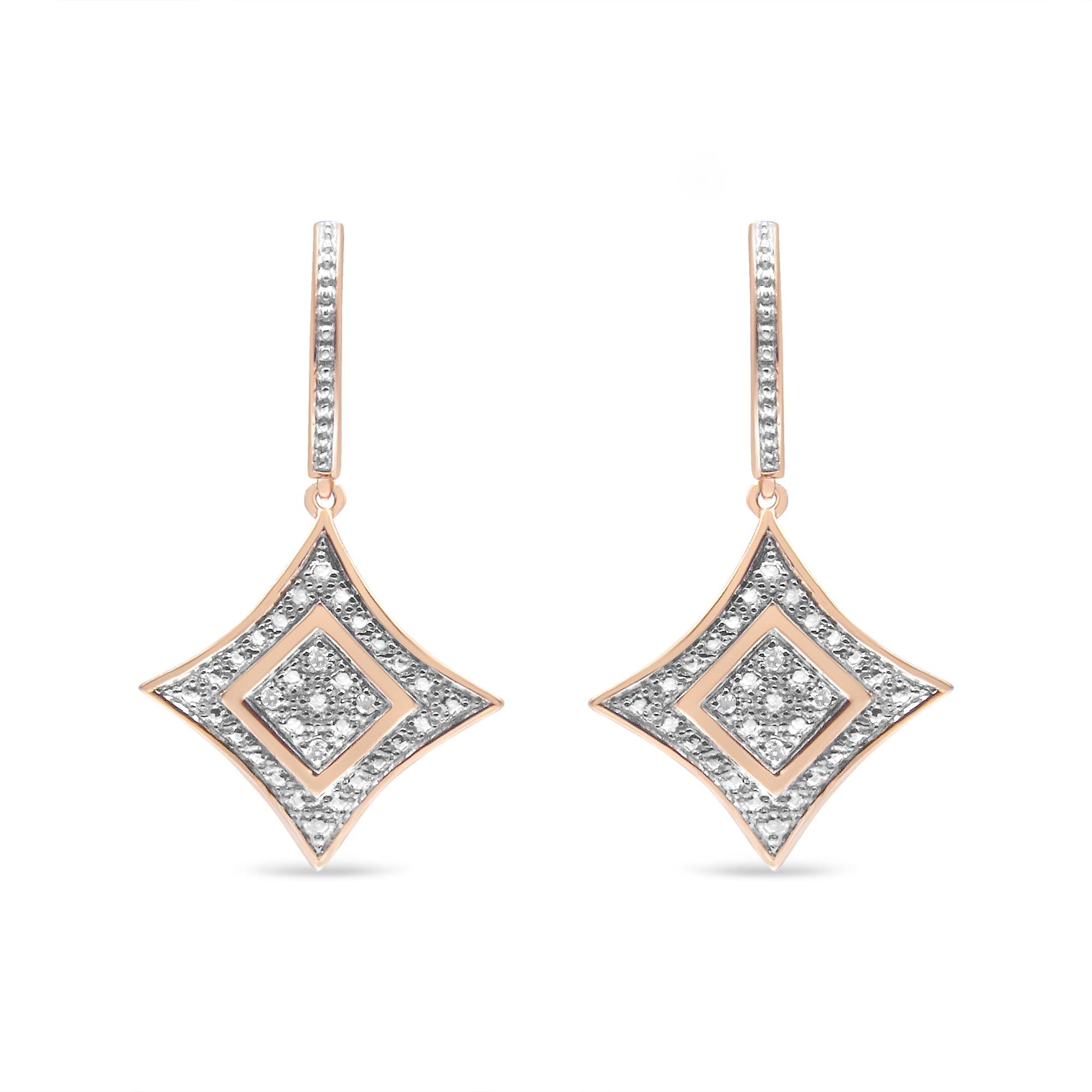 Front view of a pair of rose metal drop earrings with diamond-shaped pendants adorned with white gemstones in pave setting.