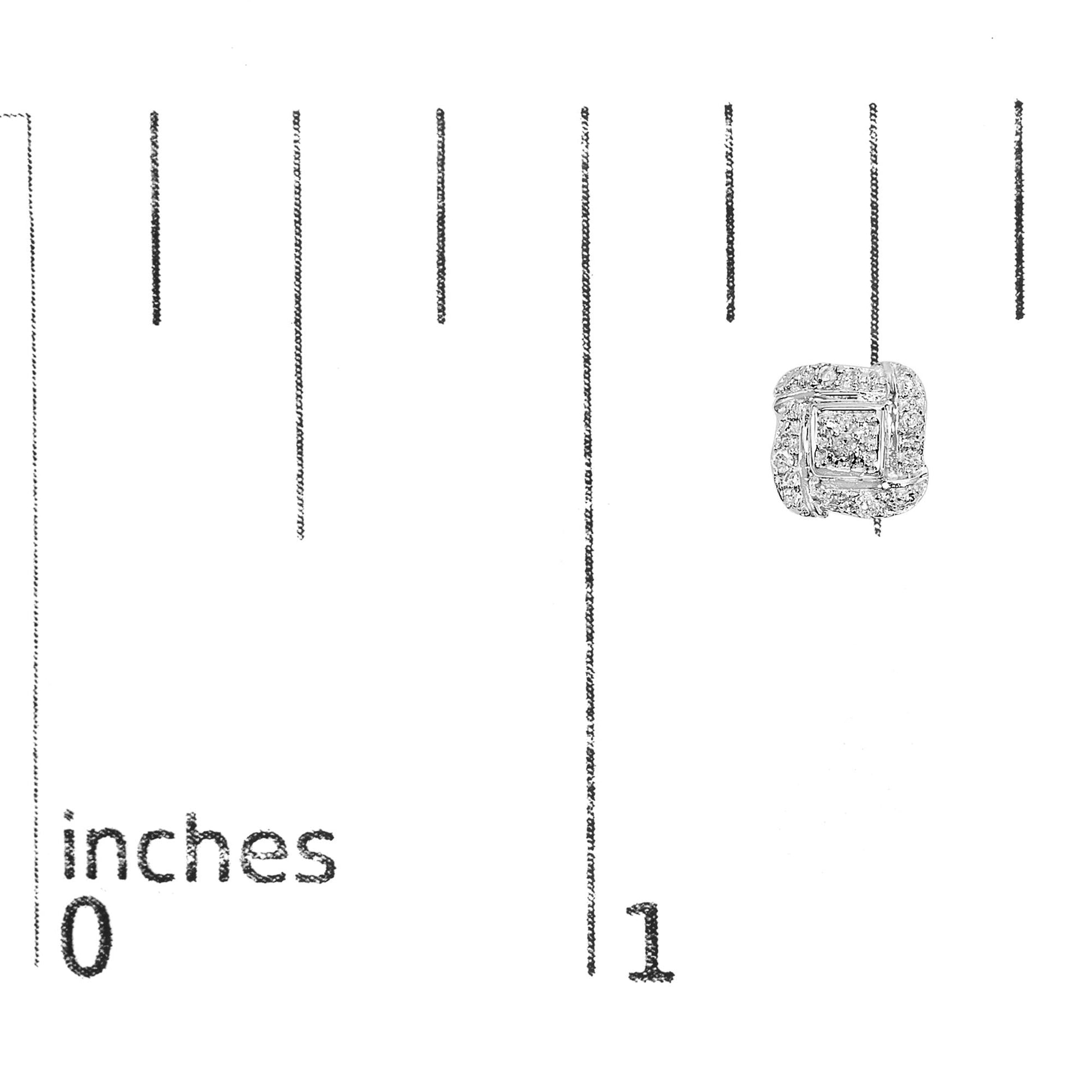 Close-up front view of a white earring with prong-set round white gemstones, shown on a ruler for size reference.