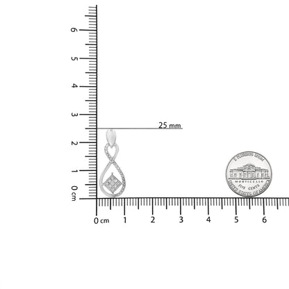 Single white metal earring with a twisted teardrop design featuring pave set round white gemstones, shown on a ruler and beside a coin for size reference, photographed from the front.