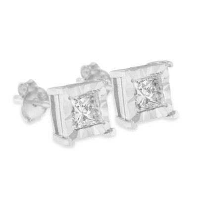 Close-up front angle of white metal stud earrings with square-shaped white gemstones in a miracle setting.
