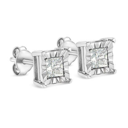 Pair of white metal stud earrings with princess-shaped white gemstones in a square setting, shown in a close-up angled view.