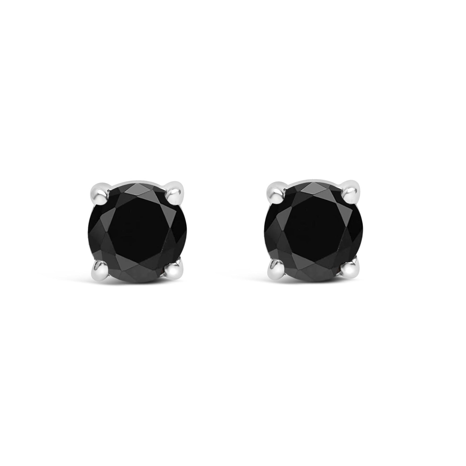 Front view of white metal stud earrings featuring round black gemstones in four-prong settings.
