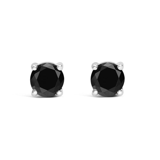 Front view of white metal stud earrings featuring round black gemstones in four-prong settings.