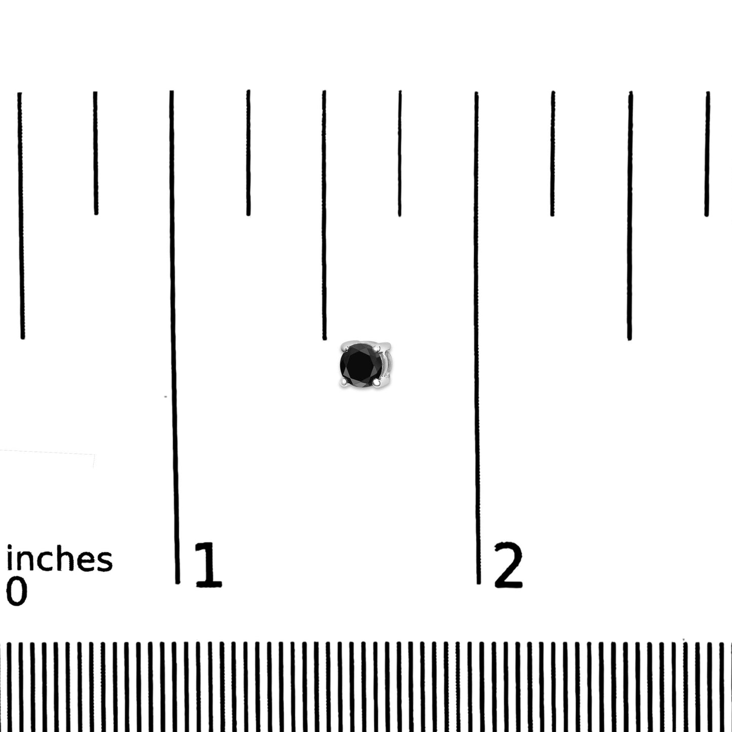 Close-up front view of a white metal stud earring with a round black gemstone in a 4-prong setting placed on a ruler for size reference.