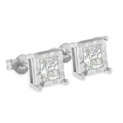 Close-up angled view of white metal stud earrings featuring princess-shaped white gemstones in miracle settings.