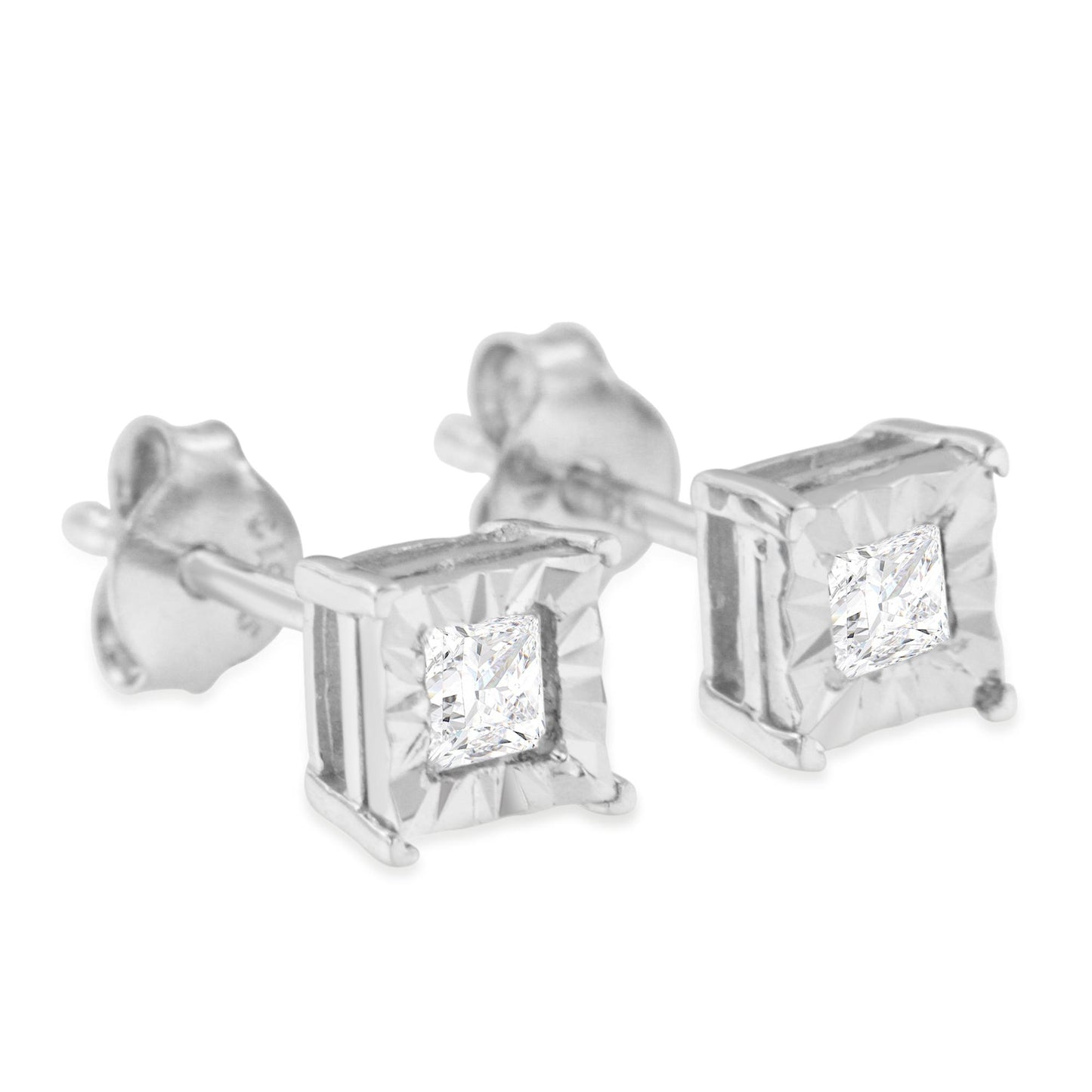 Close-up angle of white metal stud earrings with square-shaped white gemstones in a decorative setting.