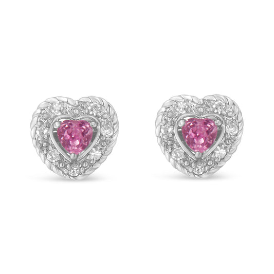 Front view of white heart-shaped earrings with a central pink heart-shaped gemstone surrounded by white round pave-set gemstones.