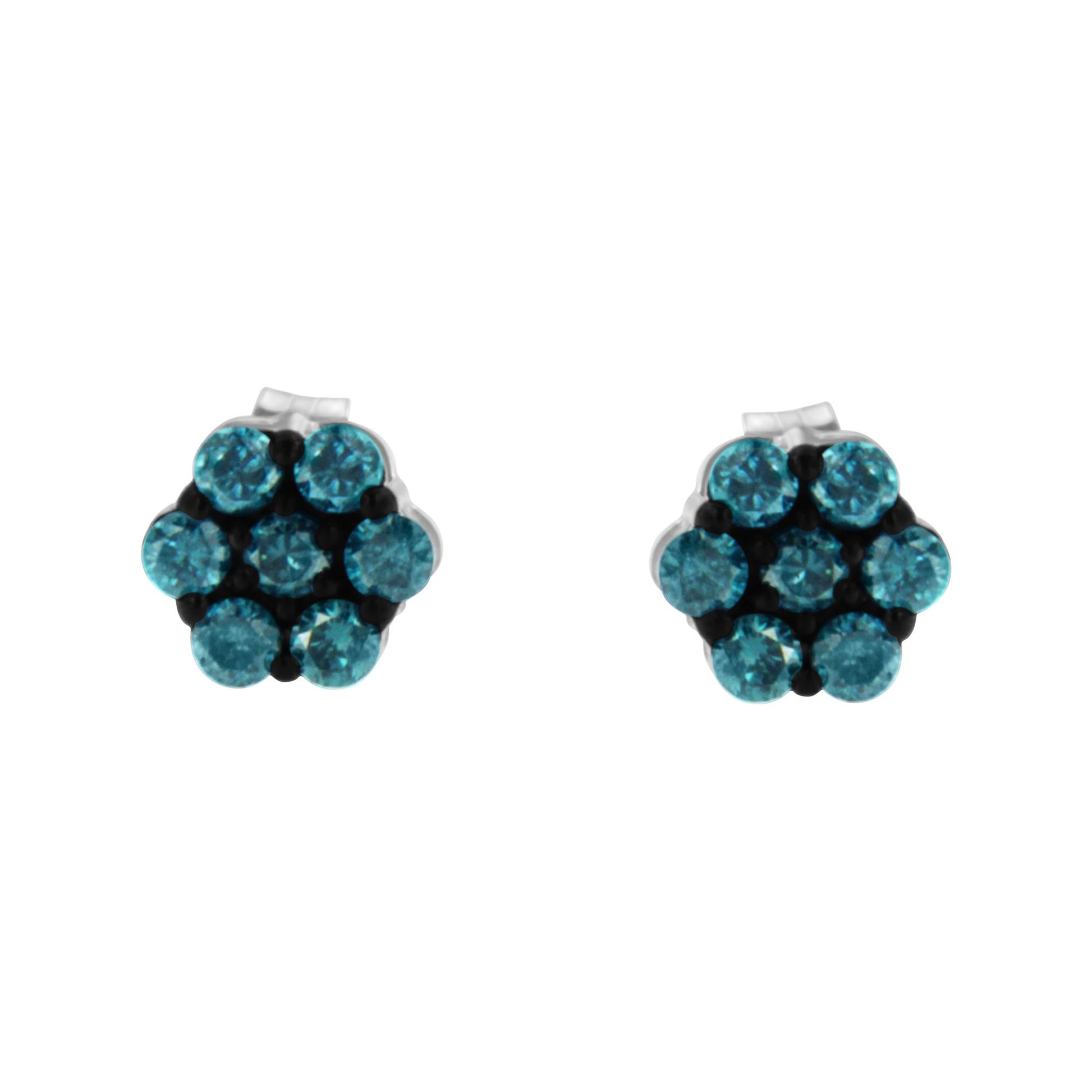 Front view of a pair of white metal stud earrings each featuring a cluster of round blue gemstones in prong settings.