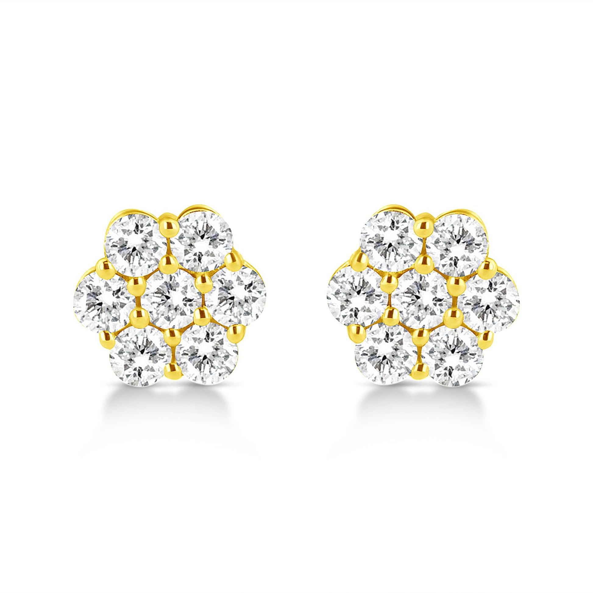 Front view of a pair of yellow metal stud earrings each with multiple round white gemstones in prong settings arranged in a floral pattern.