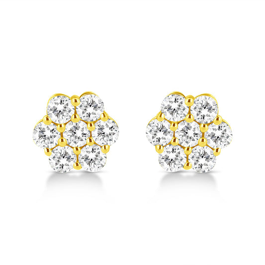 Front view of a pair of yellow metal stud earrings each with multiple round white gemstones in prong settings arranged in a floral pattern.