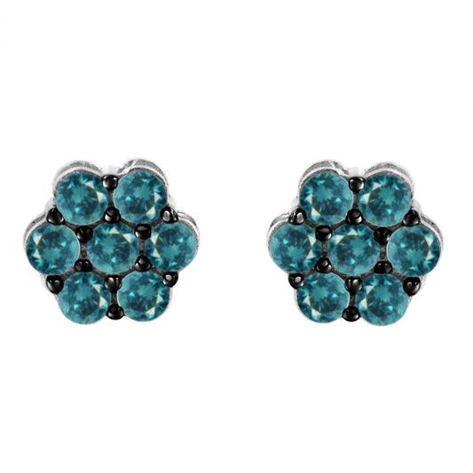 Pair of white metal flower-shaped stud earrings with round blue gemstones in prong settings, shown from the front.