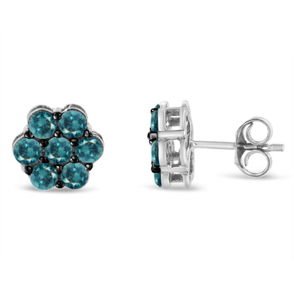Pair of white metal stud earrings with round blue gemstones in prong settings, shown from front and side angles.