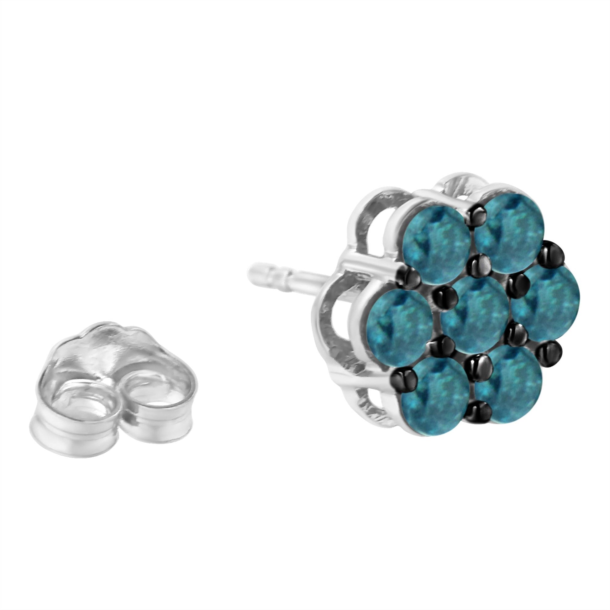 Close-up side angle of a white metal stud earring featuring a cluster of round blue gemstones in prong settings with the earring back placed nearby.