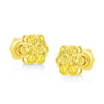 Pair of yellow metal stud earrings with clusters of round yellow gemstones in prong settings, shown from a front angle.