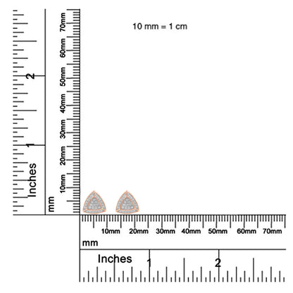 Close-up front view of rose metal triangular earrings with pave-set white round gemstones, displayed on a ruler for size reference.