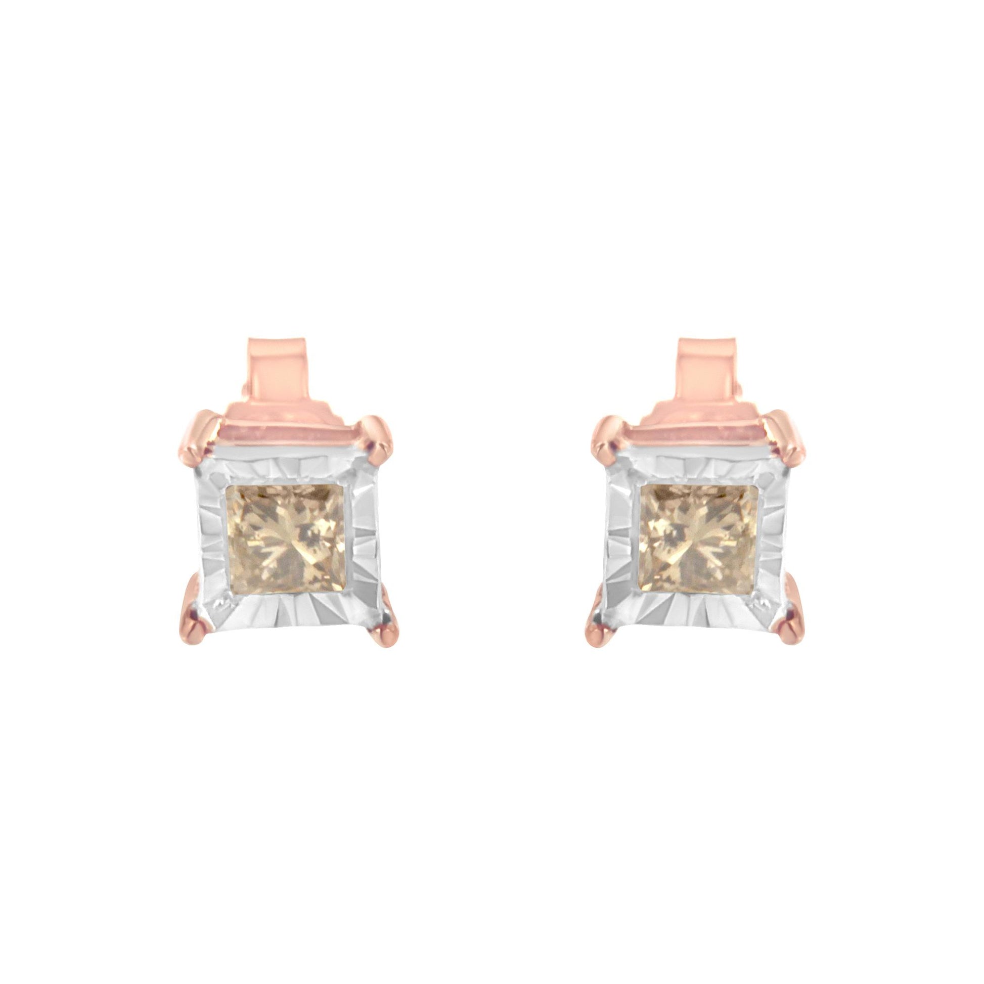 Front view of white and rose metal earrings featuring square white frames and brownish princess-shaped gemstones in a miracle setting.