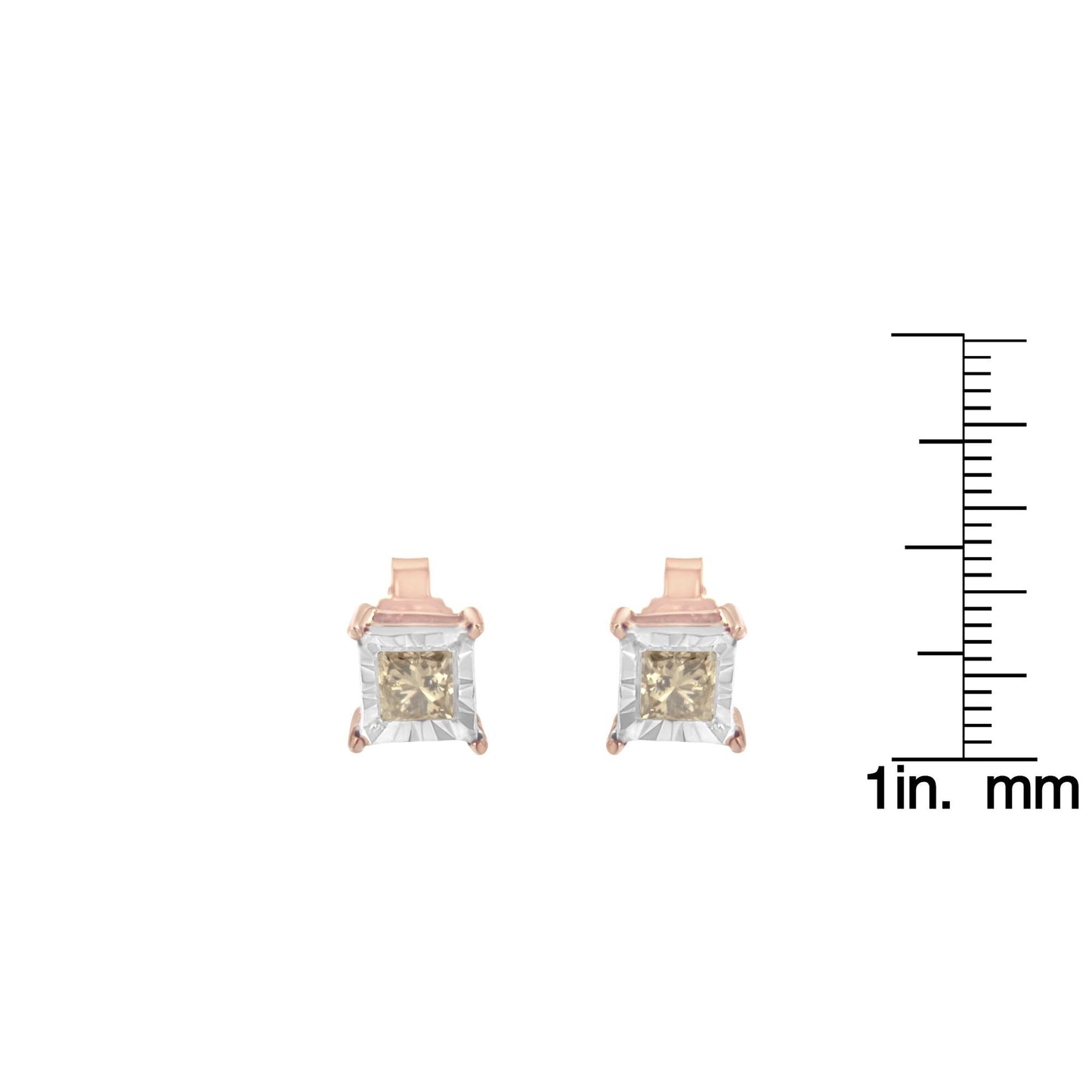 Front view of white and rose colored metal earrings with square brownish gemstones, shown next to a ruler for size reference.