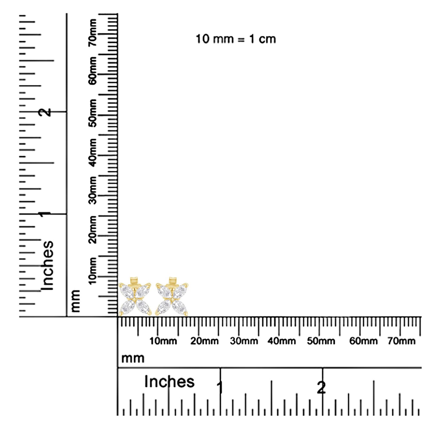 Pair of yellow metal earrings with marquise-shaped white gemstones in prong settings, shown on a ruler for size reference, front-facing angle.