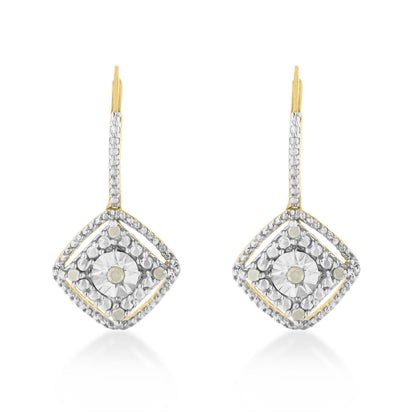 Front-facing shot of yellow metal earrings with a square-shaped design featuring round white gemstones in prong settings.